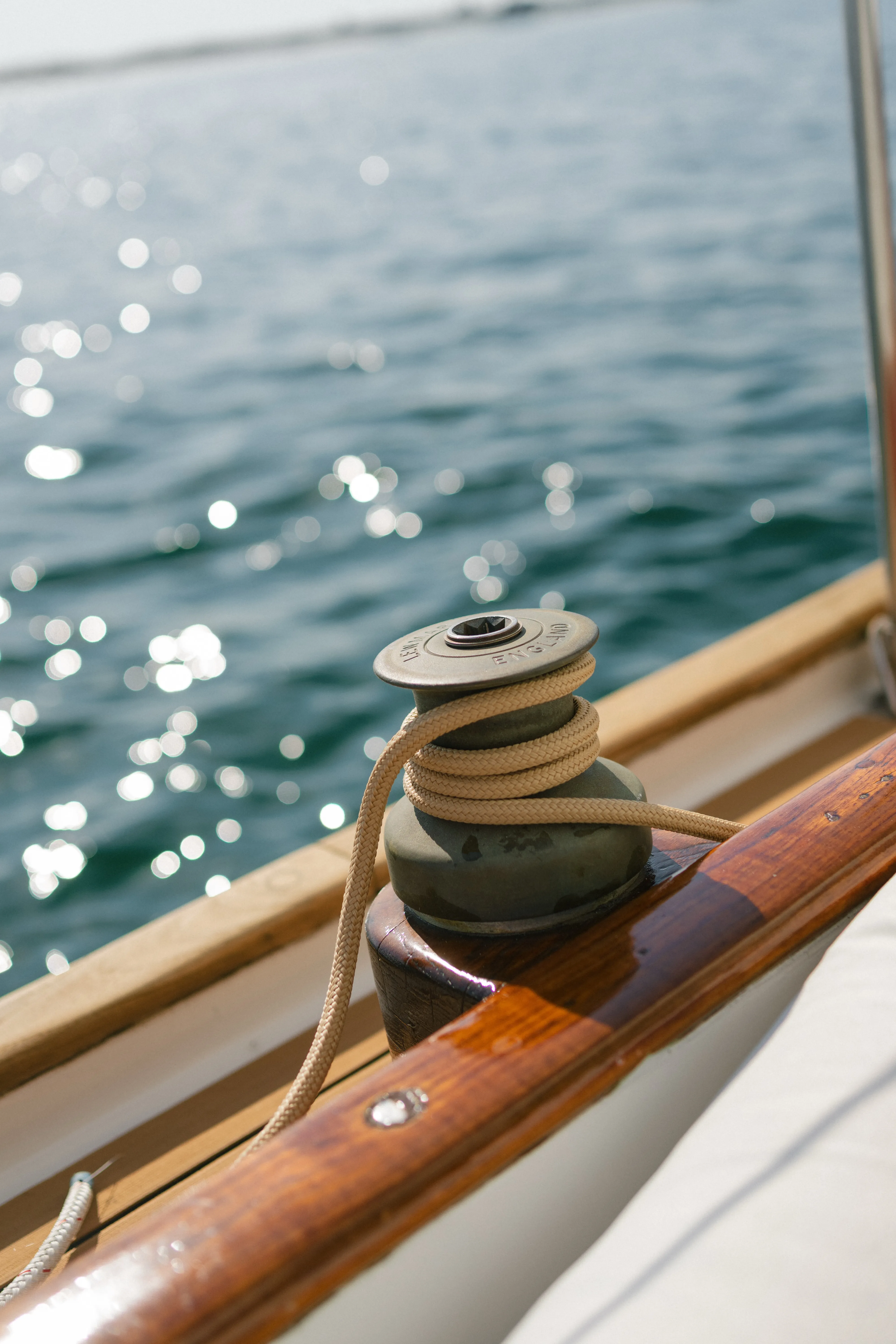 Close detail of a bronze winch and rigging line